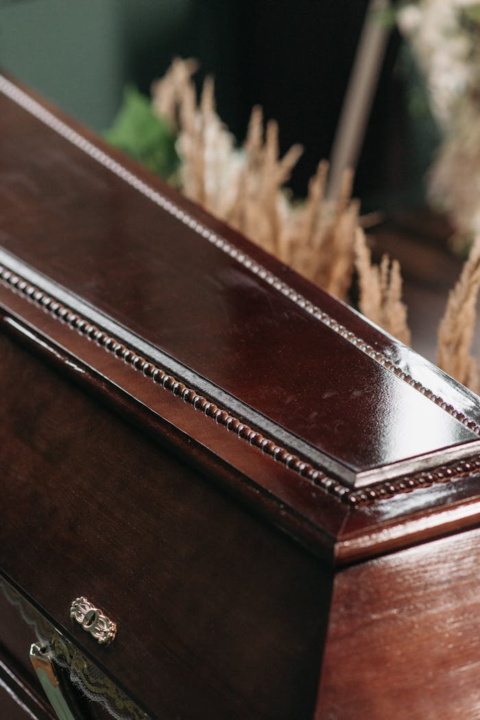 Elegant wooden coffin reflecting the somber mood of a funeral ceremony.